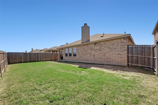 view of yard featuring a fenced backyard