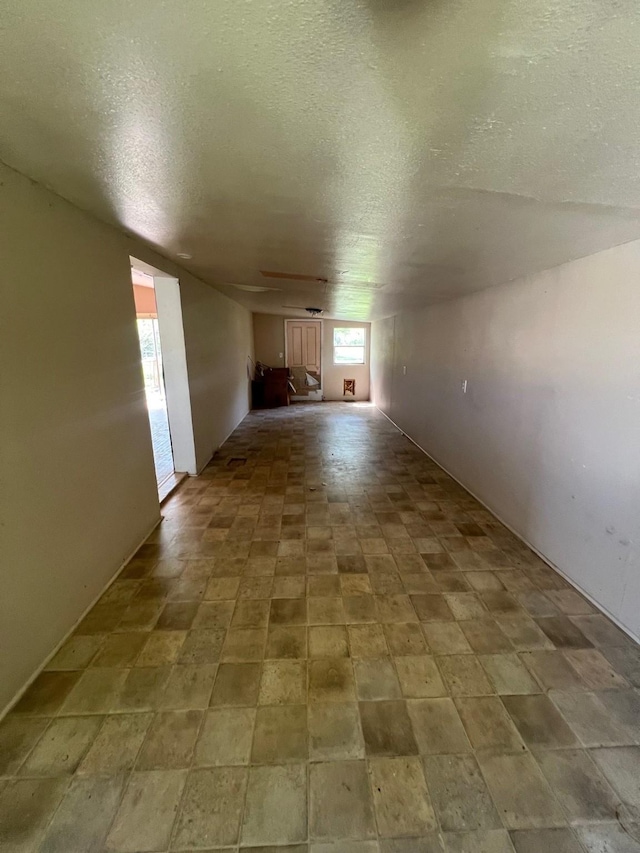 305 County Road 1607, Clifton, TX 76634 - corridor with a textured ceiling and stone finish floors