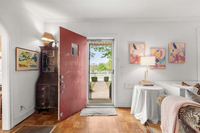 doorway to outside featuring crown molding