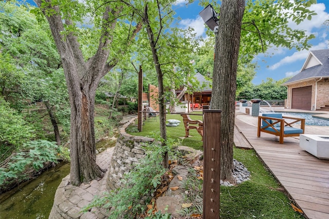 11484 Strait Ln, Dallas, TX 75229 - view of yard with a wooden deck and a garage