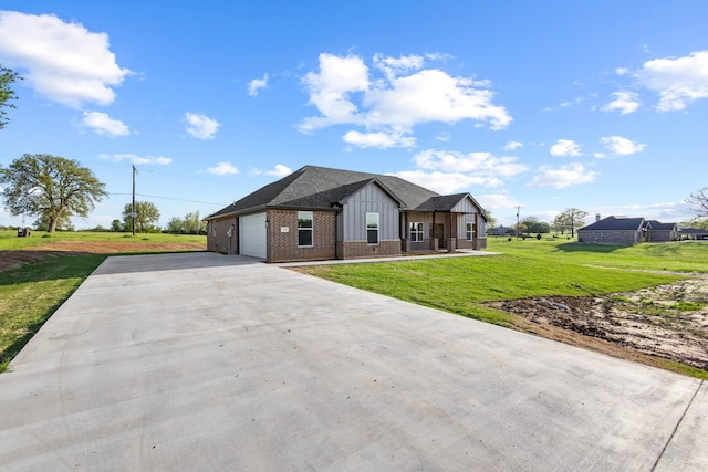 1510 S Shore Dr, Bonham, TX 75418 - view of front of home with driveway, brick siding, board and batten siding, a garage, and a front yard