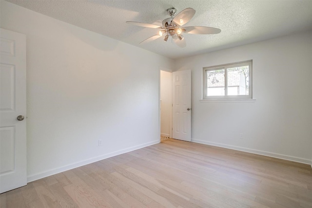 436 Nathan St, Burleson, TX 76028 - empty room featuring light wood-style floors, ceiling fan, a textured ceiling, and baseboards