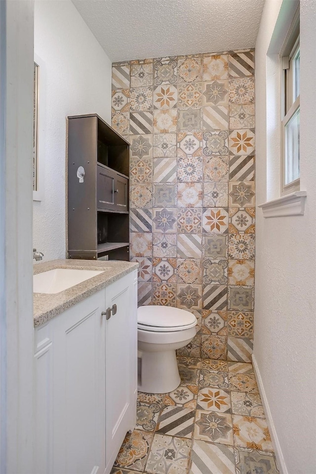 436 Nathan St, Burleson, TX 76028 - bathroom featuring toilet, vanity, and a textured ceiling