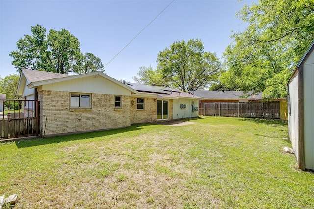 436 Nathan St, Burleson, TX 76028 - back of house featuring brick siding and roof mounted solar panels