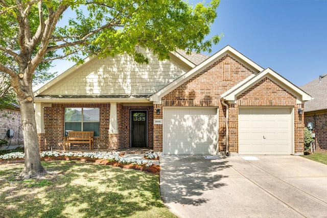 view of front of property with a garage, concrete driveway, and brick siding