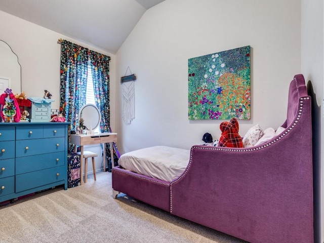 carpeted bedroom featuring vaulted ceiling