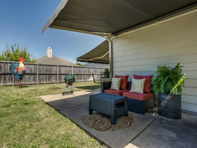 view of patio / terrace featuring a grill and fence