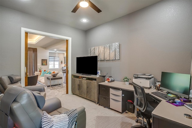 office with a ceiling fan and light carpet