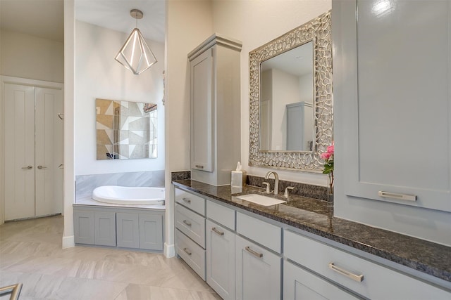 bathroom featuring a bath and vanity