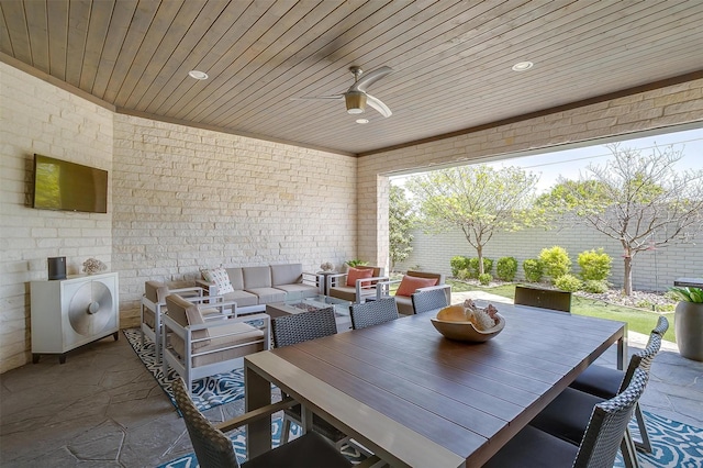 view of patio featuring outdoor dining space, an outdoor living space, and a ceiling fan