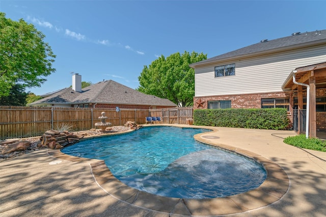view of pool with a fenced in pool, a fenced backyard, and a patio