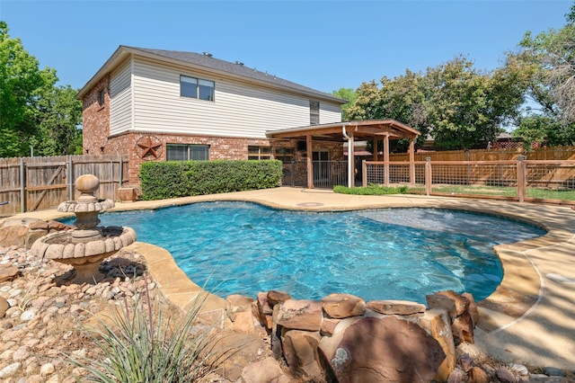 view of swimming pool with a fenced in pool, a patio area, and a fenced backyard