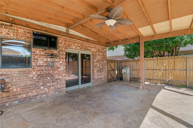 view of patio featuring fence and ceiling fan