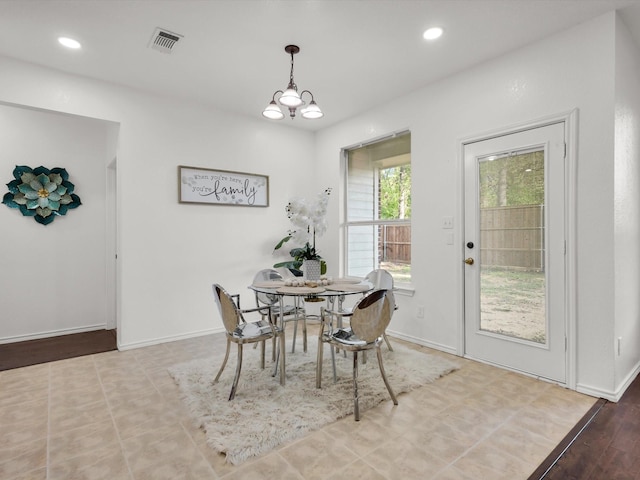 dining room featuring a chandelier, baseboards, visible vents, and recessed lighting