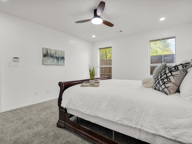 carpeted bedroom featuring visible vents, baseboards, recessed lighting, and a ceiling fan