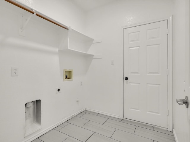 laundry area featuring laundry area, electric dryer hookup, washer hookup, gas dryer hookup, and baseboards