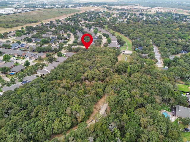 aerial view featuring a view of trees