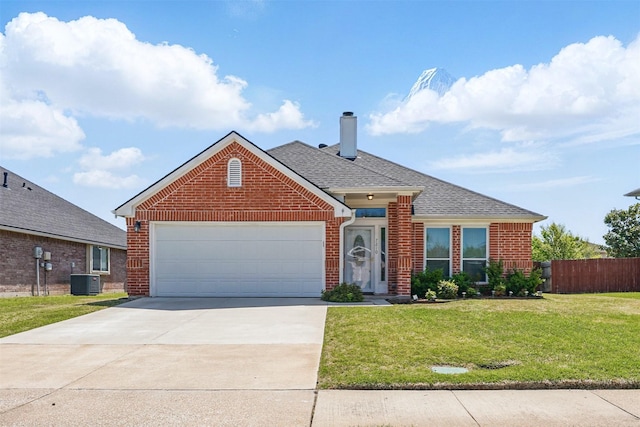 ranch-style home featuring roof with shingles, a garage, a front lawn, and brick siding