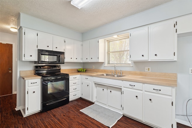 1120 S Valentine Dr, Sherman, TX 75090 - kitchen with black appliances, a sink, a textured ceiling, dark wood-style flooring, and white cabinets
