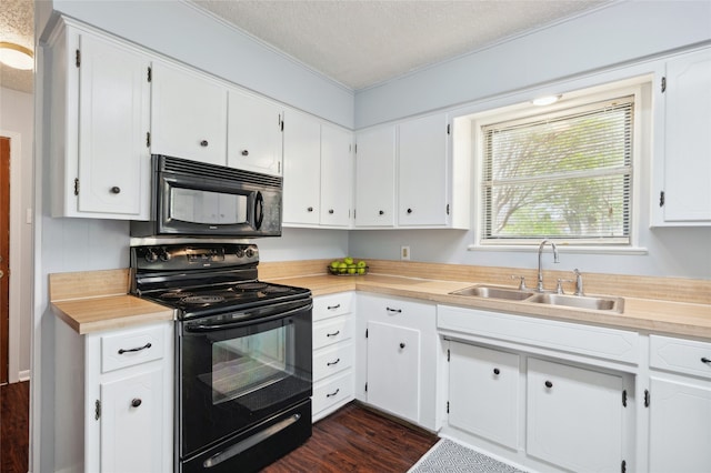 1120 S Valentine Dr, Sherman, TX 75090 - kitchen with black appliances, a sink, light countertops, a textured ceiling, and white cabinetry
