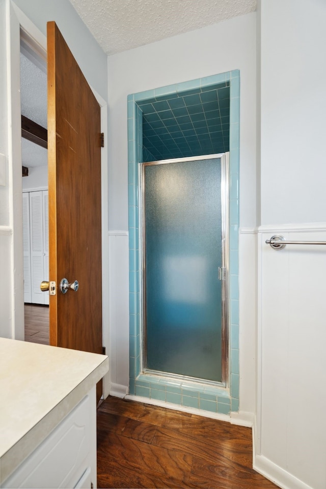 1120 S Valentine Dr, Sherman, TX 75090 - full bathroom with a textured ceiling, a stall shower, wood finished floors, and vanity