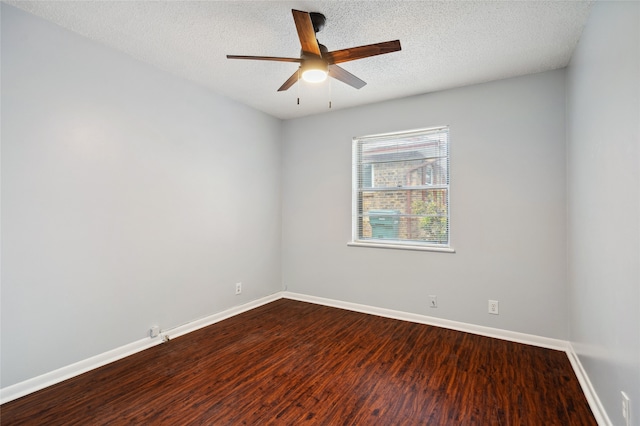 1120 S Valentine Dr, Sherman, TX 75090 - empty room with dark wood-type flooring, ceiling fan, baseboards, and a textured ceiling
