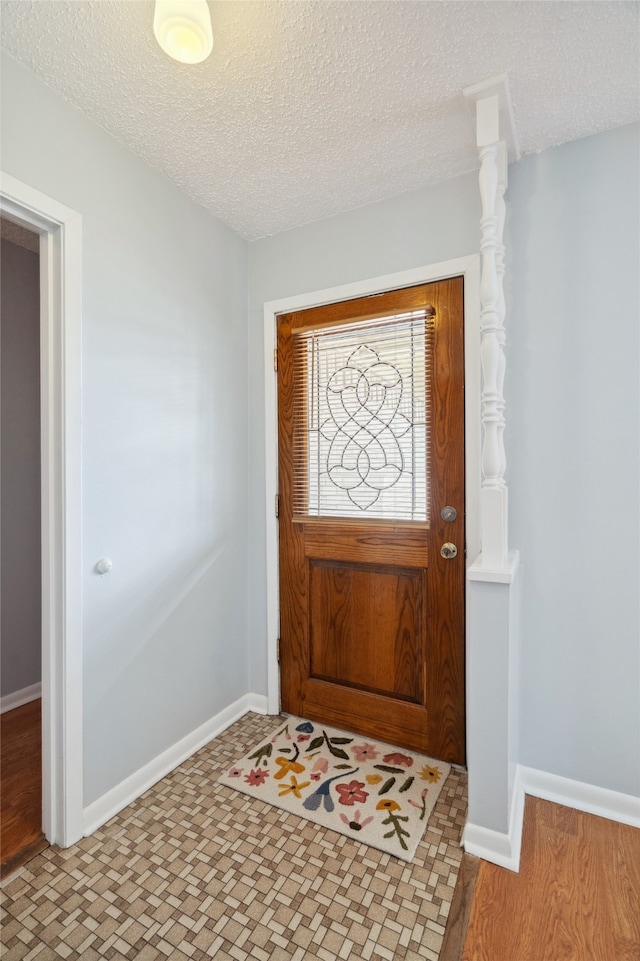 1120 S Valentine Dr, Sherman, TX 75090 - foyer entrance featuring a textured ceiling and baseboards