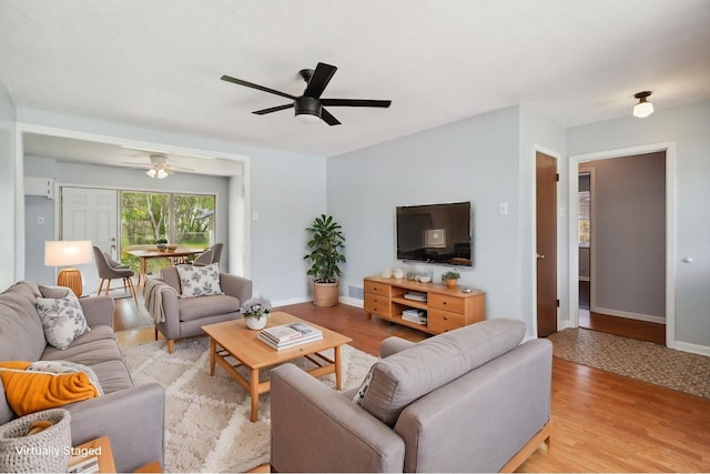 1120 S Valentine Dr, Sherman, TX 75090 - living area featuring a ceiling fan, baseboards, and light wood-style floors