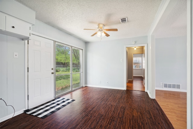 1120 S Valentine Dr, Sherman, TX 75090 - entrance foyer with ceiling fan, a textured ceiling, wood finished floors, and baseboards
