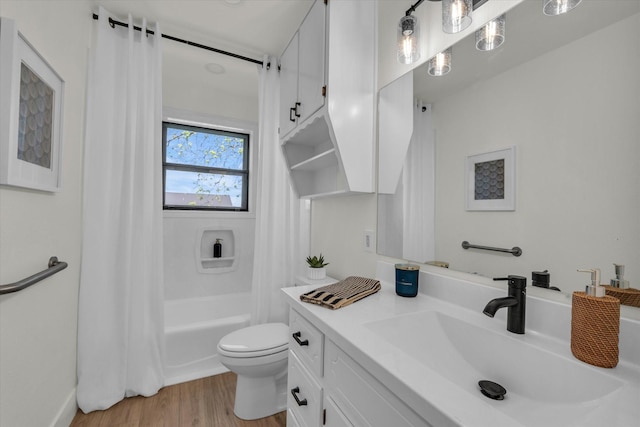full bathroom with shower / bath combo with shower curtain, vanity, toilet, and wood finished floors