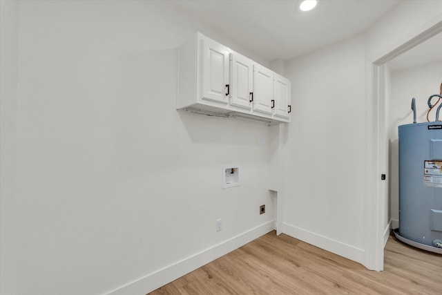 washroom featuring baseboards, washer hookup, hookup for an electric dryer, light wood finished floors, and water heater