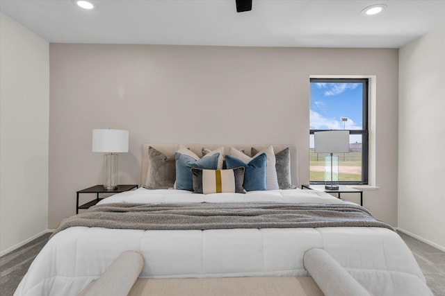 carpeted bedroom featuring recessed lighting, baseboards, and ceiling fan