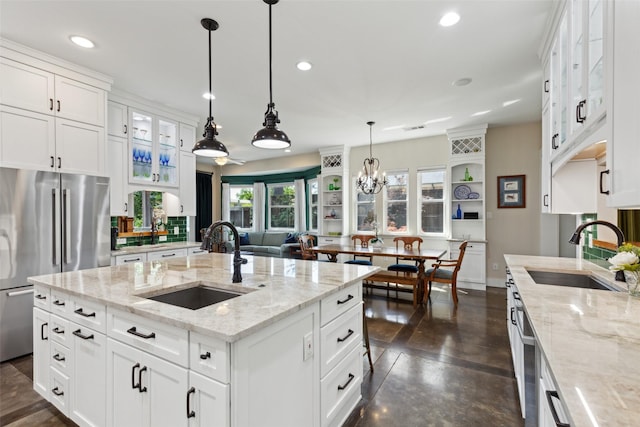 803 Surrey Ln, Grapevine, TX 76051 - kitchen with recessed lighting, a sink, appliances with stainless steel finishes, and glass insert cabinets