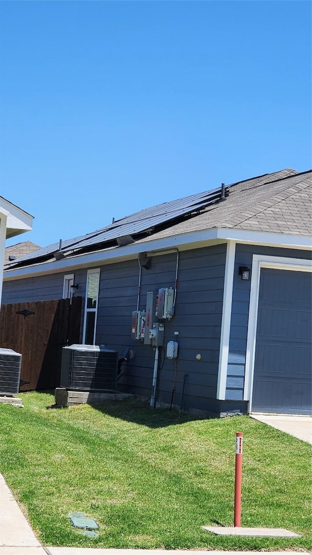 502 Cochran Dr, Princeton, TX 75407 - view of front of property with central AC, solar panels, and a garage