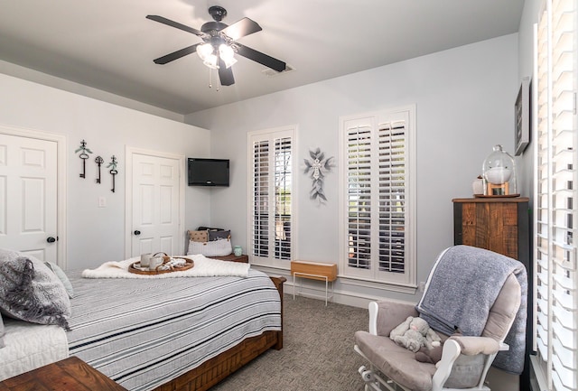 carpeted bedroom with visible vents and ceiling fan