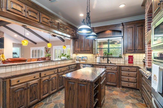 kitchen with a sink, appliances with stainless steel finishes, and recessed lighting