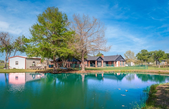 view of water feature with fence