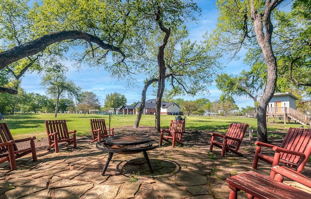 view of patio with a fire pit