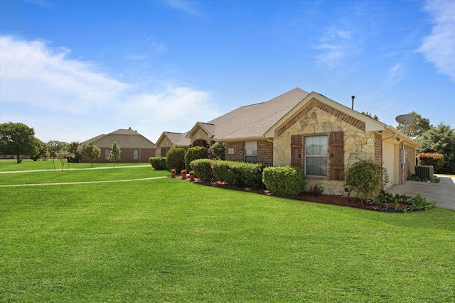 2016 Big Springs Dr, Joshua, TX 76058 - ranch-style home featuring stone siding, a front yard, a garage, driveway, and brick siding