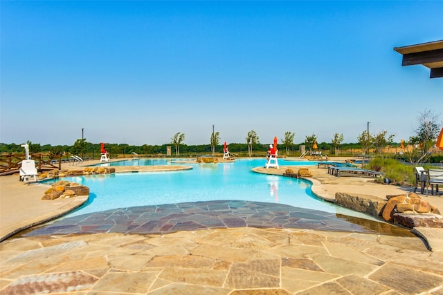 community pool featuring a patio area