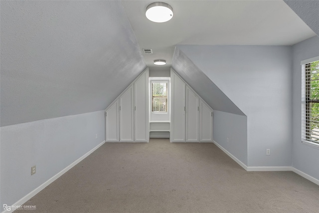 105 Devereaux Dr, Bossier City, LA 71111 - bonus room featuring baseboards, light colored carpet, and lofted ceiling