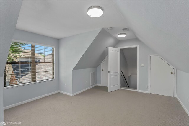 105 Devereaux Dr, Bossier City, LA 71111 - bonus room with visible vents, baseboards, light carpet, and lofted ceiling