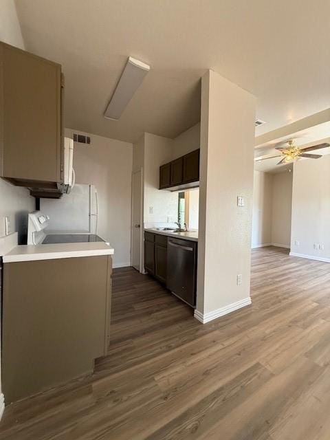 7126 Holly Hill Dr Unit 304, Dallas, TX 75231 - kitchen with baseboards, light countertops, ceiling fan, dishwasher, and wood finished floors