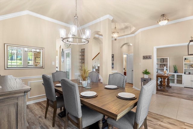 191 Cardiff Ln, Waxahachie, TX 75167 - dining area with crown molding, arched walkways, a notable chandelier, and wood finished floors