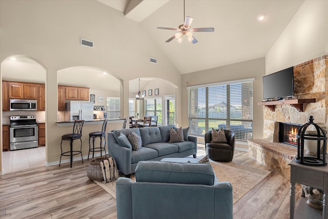191 Cardiff Ln, Waxahachie, TX 75167 - living room featuring light wood-type flooring, visible vents, ceiling fan, and high vaulted ceiling