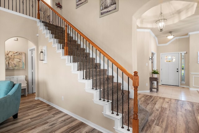 191 Cardiff Ln, Waxahachie, TX 75167 - entryway featuring arched walkways, ornamental molding, a high ceiling, and wood finished floors