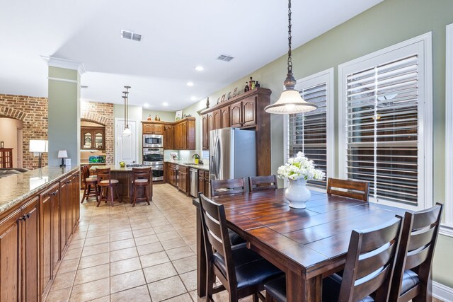 dining space featuring light tile patterned floors and recessed lighting