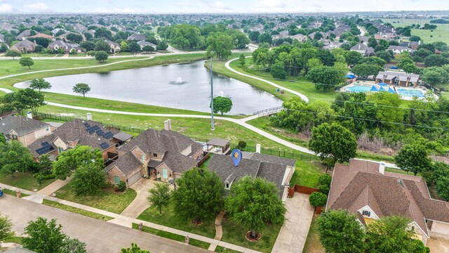 aerial perspective of suburban area with a large body of water
