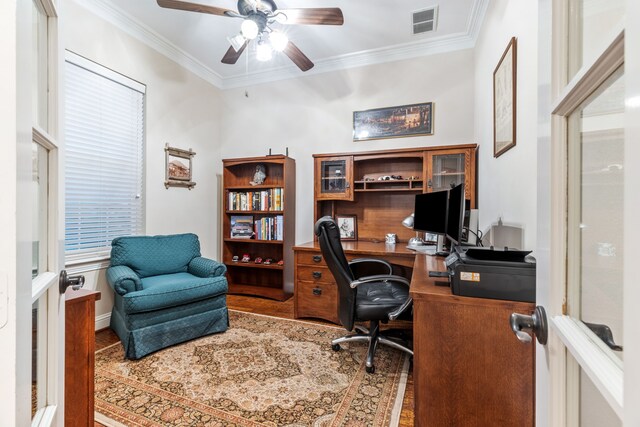 office area with ornamental molding, ceiling fan, and wood finished floors
