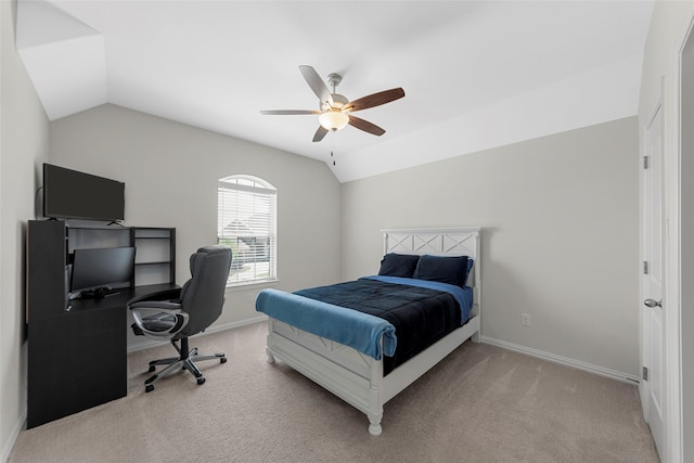 carpeted bedroom with ceiling fan, baseboards, and lofted ceiling